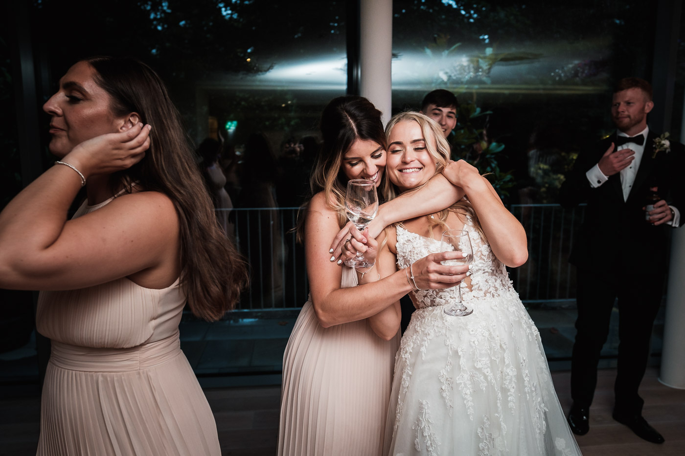 bride and her friends dance at the old palace in chester